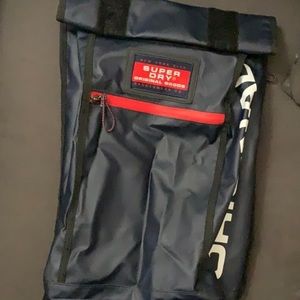 SÚPER DRY ROLLUP BACKPACK NAVY BLUE AND RED